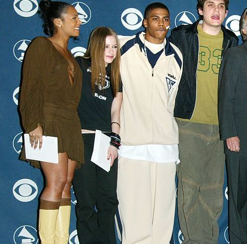 NEW YORK - JANUARY 7:  Presenters (R-L) Ashanti, Avril Lavigne, Nelly, John Mayer, John Portnow, Cyndi Lauper, Kenny Chesney, Jimmy Jam and Justin Timberlake pose at the nomination announcements for 45th Annual Grammy Awards at Madison Square Garden January 7, 2003 in New York City.   (Photo by Matthew Peyton/Getty Images)