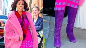 Gayle King wearing purple Christian Louboutin boots in New York City on Feb. 18, 2025.