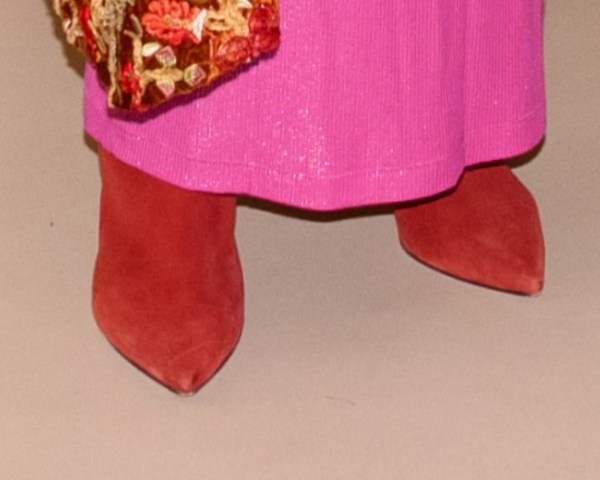 Gayle King Pairs Purple Louboutin Boots With Vibrant Ensemble in NYC