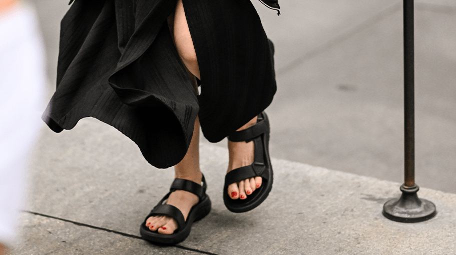 woman wearing black orthopedic sandals